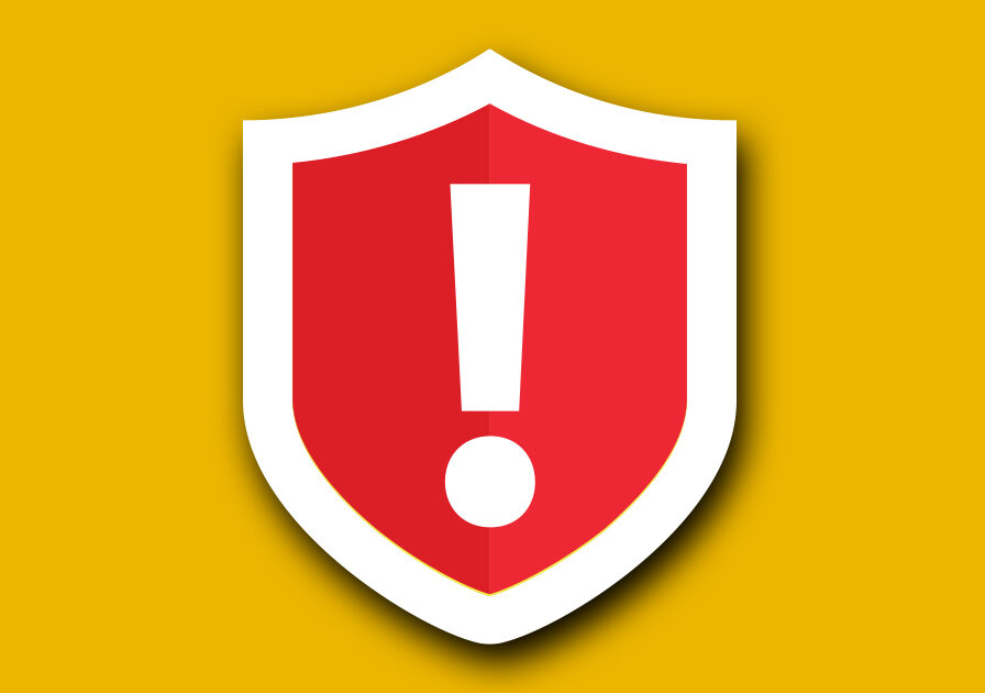 A red shield with a white exclamation mark in the center displayed on a yellow background. The exclamation mark indicates a warning or alert.