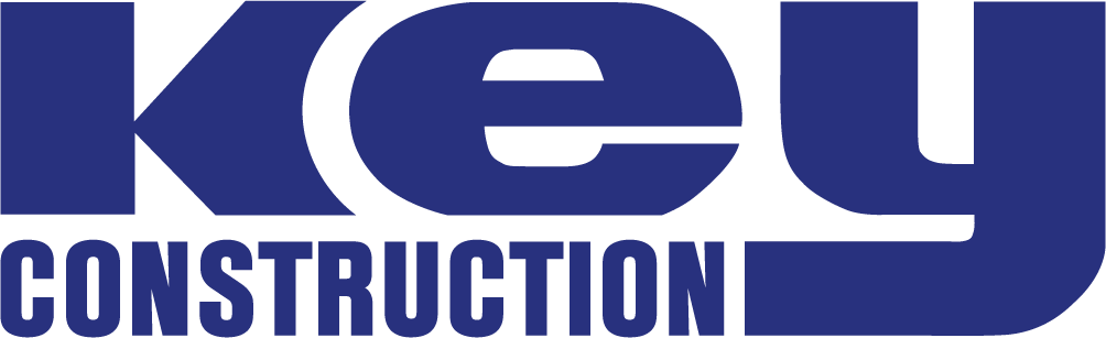 The image displays a blue logo with the words "Key Construction" in bold text. The word "Key" is large and positioned above "Construction," which is smaller.